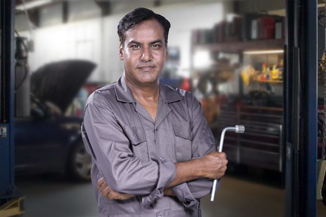 Photo of shop manager smiling