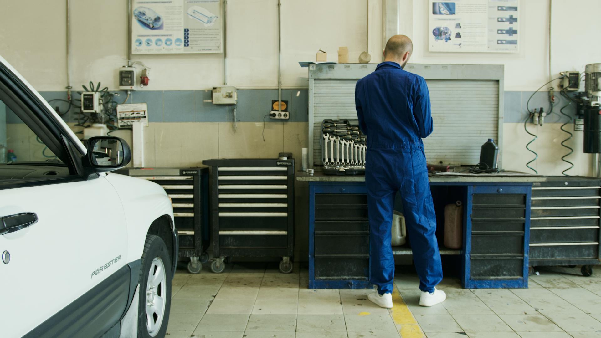 Mechanic showing a customer a part on a tablet