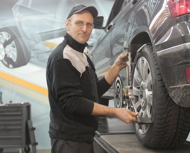 Photo of happy auto shop owner